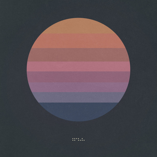 Awake by Tycho, a multicolored circle on a dark background